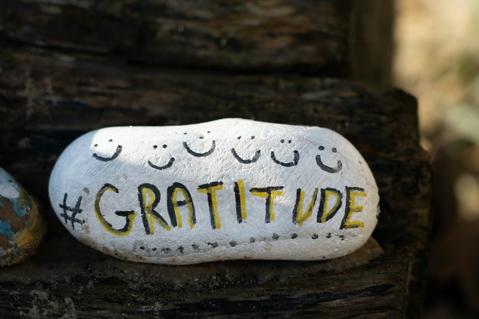 a white and yellow object with writing on it